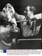 Rocky Marciano (r) Inspects The Facial Damage To Tony Hughes After The Latter Had Been Forced To Quit At The End Of The Fifth Round Of His Fight With Henry Cooper. The Contest Took Place At Olympia Circus London January 1962.