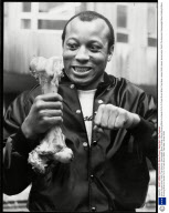 James 'bonecrusher' Smith The American Heavyweight Boxer Holding A Bone Showing What He Intends To Do To Frank Bruno When They Meet. James Smith