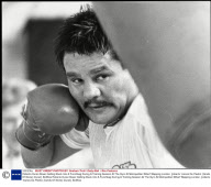 Roberto Duran Boxer Getting Stuck Into A Punchbag During A Training Session At The Gym At Metropolitan Wharf Wapping London. [roberto 'manos De Piedra' (hands Of Stone) Duran]. Bo554a