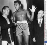 Henry Cooper And Cassius Clay Weigh In On Stage At The London Palladium For Tonights Fight At Wembley. P.s The Familiar Five Fingers Sign By Clay As He Shakes Hands With Cooper. Muhammad Ali