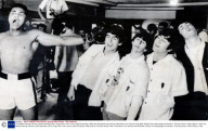 The Beatles George Harrison (died November 2001) Ringo Starr John Lennon (died December 1980) And Paul Mccartney Take A Fake Blow From Cassius Clay While Visiting The Heavyweight Contender''s Training Camp In Miami Beach. 1964