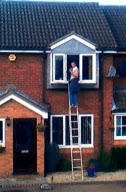 Window cleaner filmed leaning into open bedroom window to steal credit card, Telford, Britain - 05 Feb 2012