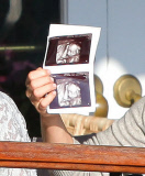 Molly Sims Showing Off Her Sonogram At Lunch