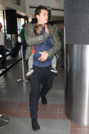 Orlando Bloom and Flynn catch a flight out of LAX