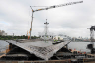 Giant chandelier being moved across Sydney Harbour to floating stage at Royal Botanic Gardens for Handa Opera's production of La Traviata, Sydney, Australia - 16 Mar 2012
