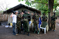 'Invisible Children' founders pose with Sudan People's Liberation Army