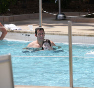 Actor Adam Sandler spends a family day poolside with daughters Sadie and Sunny during a visit to Miami Beach. 