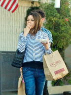 Mila Kunis Has a Mouthful of Spring Rolls