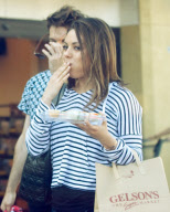 Mila Kunis Has a Mouthful of Spring Rolls