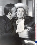Actor Sean Connery Kisses Honor Blackman On The Cheek The Two Appeared Together In The James Bond Film Goldfinger; Connery Played James Bond With Blackman Playing Pussy Galore.