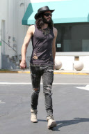 Russell Brand squeezes in a AA Meeting