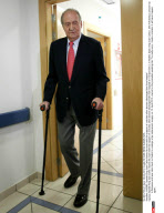  MADRID: Spanish King Juan Carlos leaves his room with the support of crutches after doctors discharged him from hospital