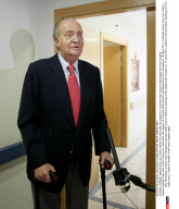  MADRID: Spanish King Juan Carlos leaves his room with the support of crutches after doctors discharged him from hospital