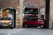 Woman's car becomes stuck in historic 'South Gates' gateway after collision, King's Lynn, Norfolk, Britain - 17 Apr 2012