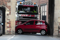 Woman's car becomes stuck in historic 'South Gates' gateway after collision, King's Lynn, Norfolk, Britain - 17 Apr 2012