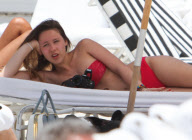 Michelle Hunziker Hangs On The Beach