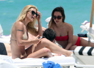 Michelle Hunziker Hangs On The Beach