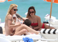 Michelle Hunziker Hangs On The Beach