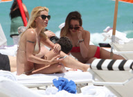 Michelle Hunziker Hangs On The Beach