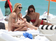 Michelle Hunziker Hangs On The Beach