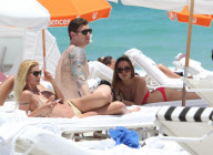 Michelle Hunziker Hangs On The Beach