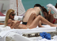 Michelle Hunziker Hangs On The Beach