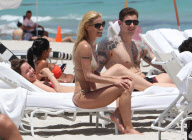 Michelle Hunziker Hangs On The Beach