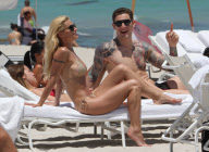 Michelle Hunziker Hangs On The Beach