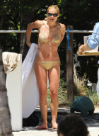 Michelle Hunziker Hangs On The Beach