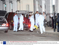 The Body Of An Mi6 Worker Gareth Williams Is Removed From The House In Alderney Street Pimlico Sw1 As Police And Forensic Officers Look On.