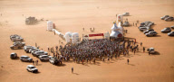 Man completes 155 mile Sahara desert 'Marathon Des Sables' with ironing board strapped to his back, Britain - Apr 2012