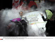 FRA: Francois Hollande receives flour, thrown by a woman flavour, thrown by a woman