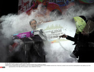 FRA: Francois Hollande receives flour, thrown by a woman flavour, thrown by a woman