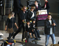 Johnny Hallyday and Laetitia arrived with their children, Jade and Joy, at Roissy airport in Paris.