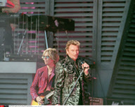 PARIS: JOHNNY HALLYADAY IN CONCERT AT     CHAMP DE MARS NEAR THE EIFFEL TOWER. THE