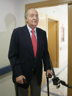 KING JUAN CARLOS leaving the hospital after undergoing hip replacement surgery