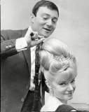 Hairdresser Vidal Sassoon Of Bond Street Putting The Finishing Touches To The Hair Of Singer Miss Denney Dayviss. The 'beehive' Hairdo Was Very Popular During The Sixties Achieved By Backcombing The Hiar Until It Resembles Candy Floss And Then Smoo