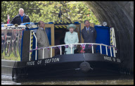 Queen Elizabeth tours canals with Prince Philip and Charles