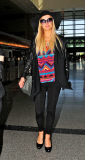 Paris Hilton Is All Smiles As She Departs