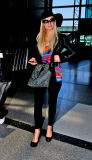 Paris Hilton Is All Smiles As She Departs