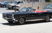 Justin Timberlake driving his vintage GTO with a mystery brunette