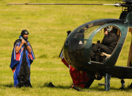 Gary Connery becomes first man to jump out of helicopter in wingsuit and land without deploying parachute, Britain - 23 May 2012