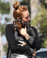 Miley Cyrus loving up her pup!