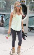 Ashley Tisdale heads to spin class wearing blue shades