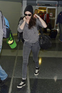 Kristen Stewart at JFK in dark colors