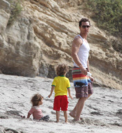 Matthew McConaughey takes Vida and Levi to the beach in a tank top