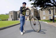 Man starts own Penny Farthing bicycle postal service in Bude, Cornwall, Britain - May 2012