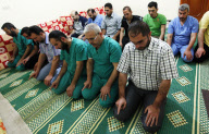 Medical staff prays in field hospital