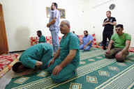 Medical staff prays in field hospital