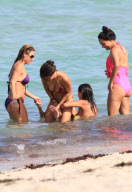 Playboy model Arianny Celeste pours fierce curves into snakeskin bikini 